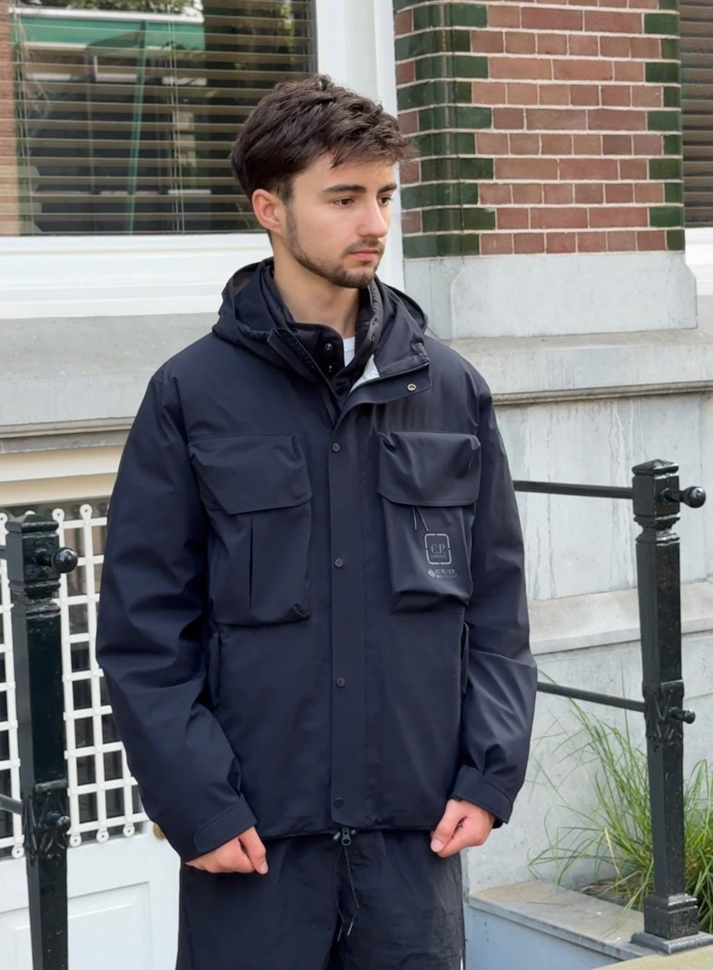 Model with black wind jacket