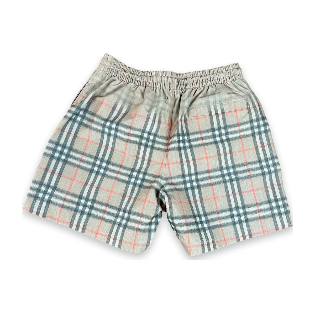 A pair of plaid boxer shorts with an elastic waistband, featuring a beige base with a green and orange checkered pattern, shown against a plain white background.