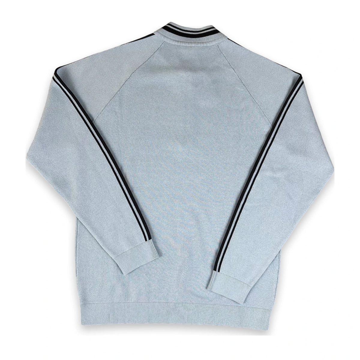 A light gray heathered long-sleeve track jacket shown from the back, featuring black and white double stripes running down the sleeves and around the ribbed collar.