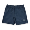 A pair of dark navy blue shorts with an elastic waistband, side pockets, and a small Stone Island logo patch on the lower left leg, shown against a plain white background.