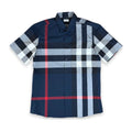 A short-sleeve button-up plaid shirt in navy blue, light gray, white, and red, laid flat against a white background.