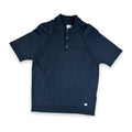 A dark navy blue short-sleeve polo shirt with a two-button placket and a chest pocket, laid flat against a white background.
