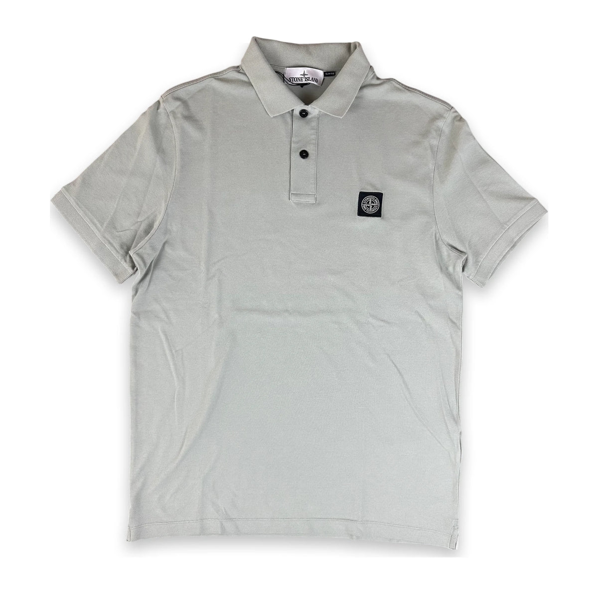 A light gray short-sleeve polo shirt with a two-button placket and a small black square logo patch on the left chest, displayed flat against a white background.