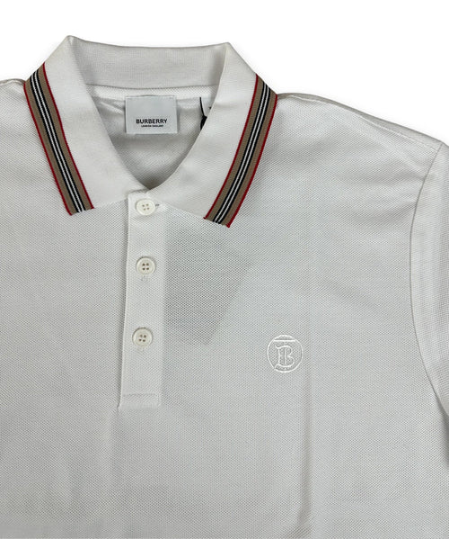 A white Burberry polo shirt with a striped navy, red, and gold collar, featuring a three-button placket and a small embroidered crest on the chest.