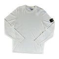 An off-white long-sleeve crewneck shirt by Stone Island, featuring the brand's signature compass badge on the left sleeve, laid flat against a white background.