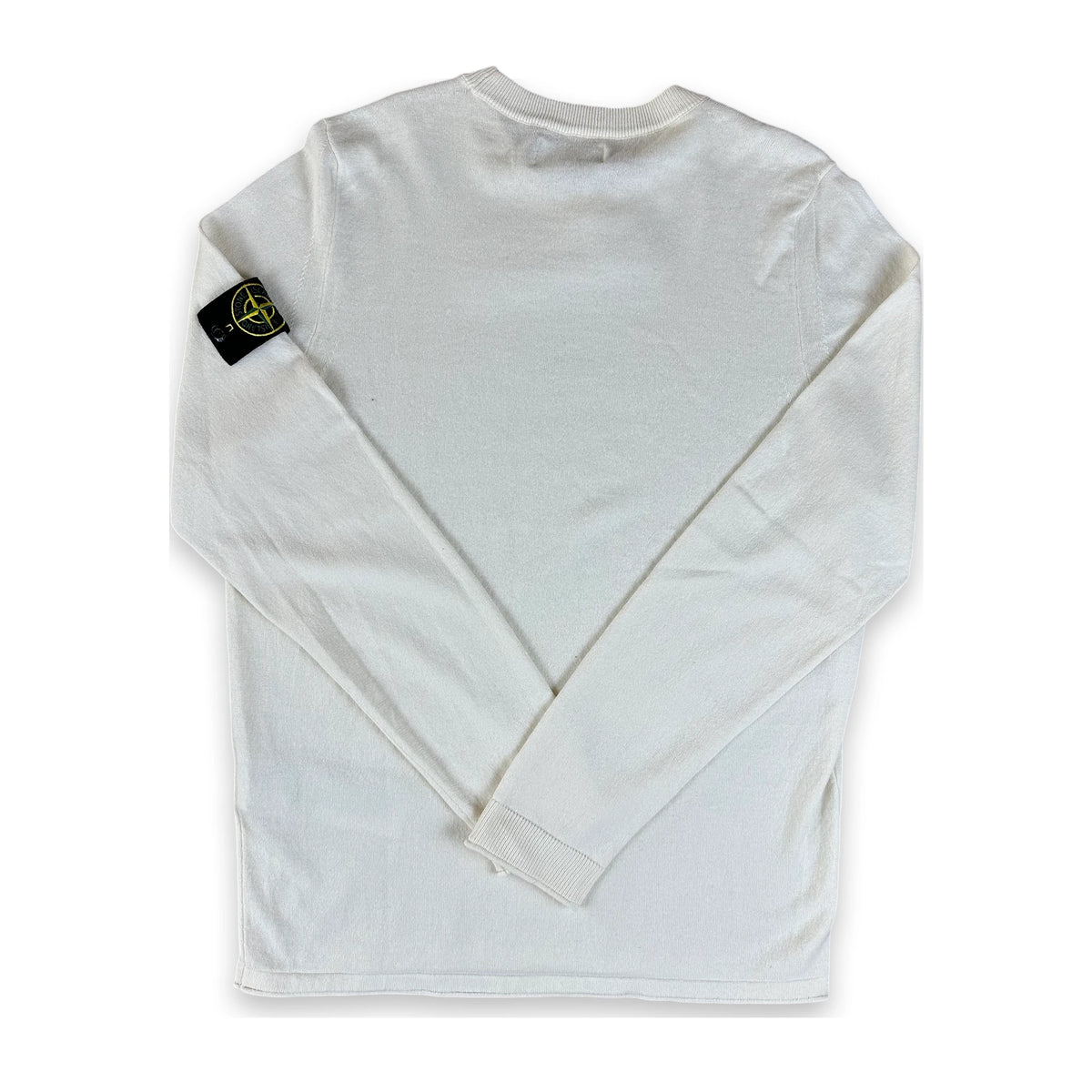 A white long-sleeve t-shirt with the Stone Island compass logo patch on the left sleeve, laid flat against a white background.