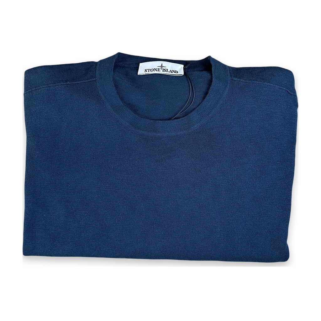 A folded navy blue crewneck sweater from Stone Island, shown on a clean white background.