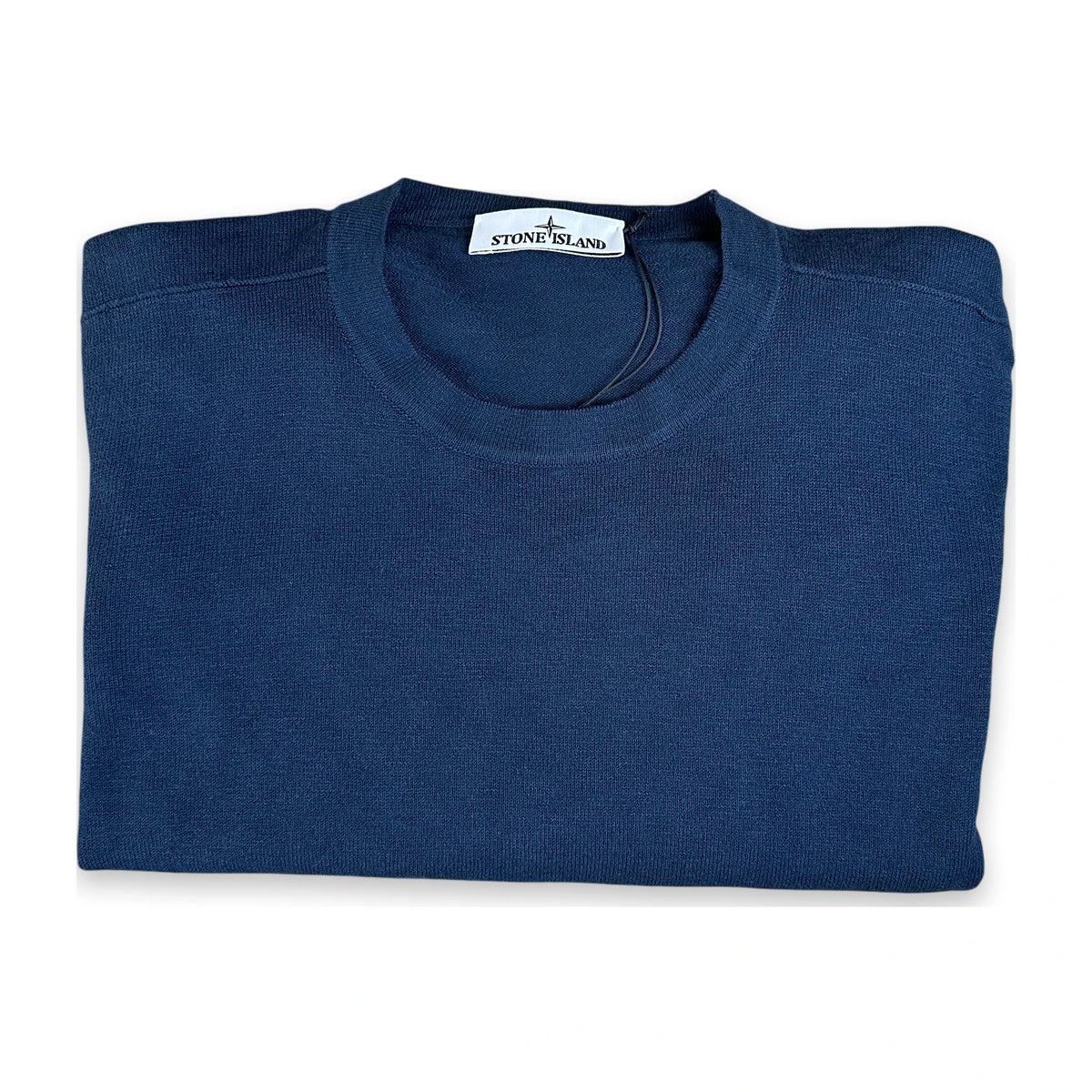 A folded navy blue crewneck sweater from Stone Island, shown on a clean white background.