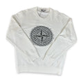 An off-white crewneck sweatshirt featuring the circular Stone Island compass logo printed in gray on the center chest, displayed flat against a white background.