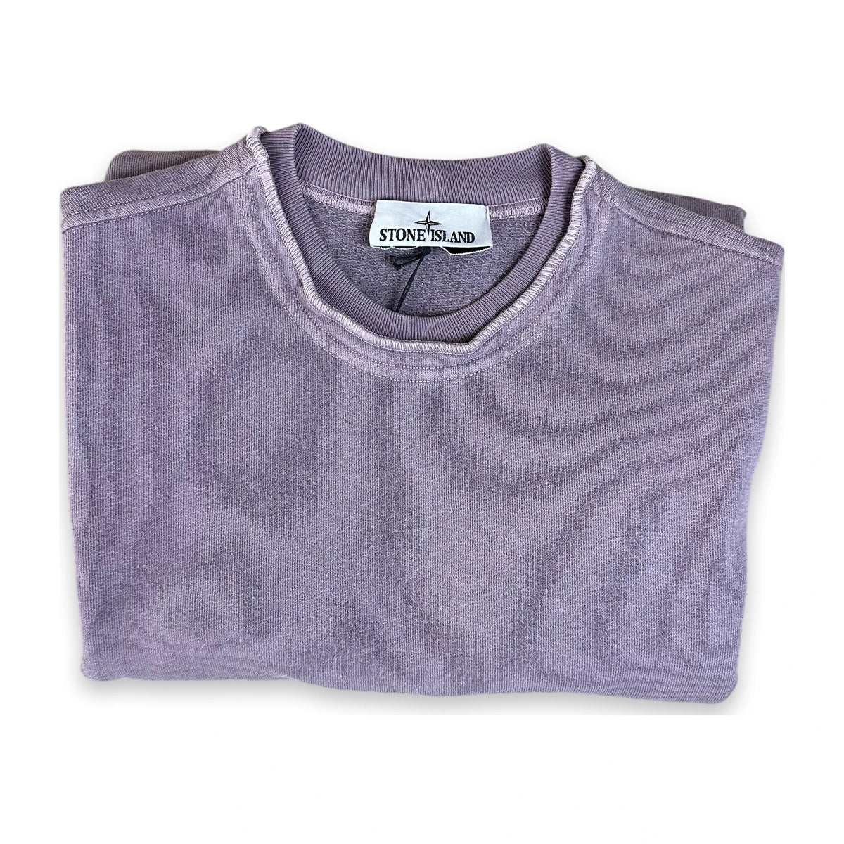 A folded Stone Island crewneck sweatshirt in a dusty lavender-purple color, displayed on a clean white background.
