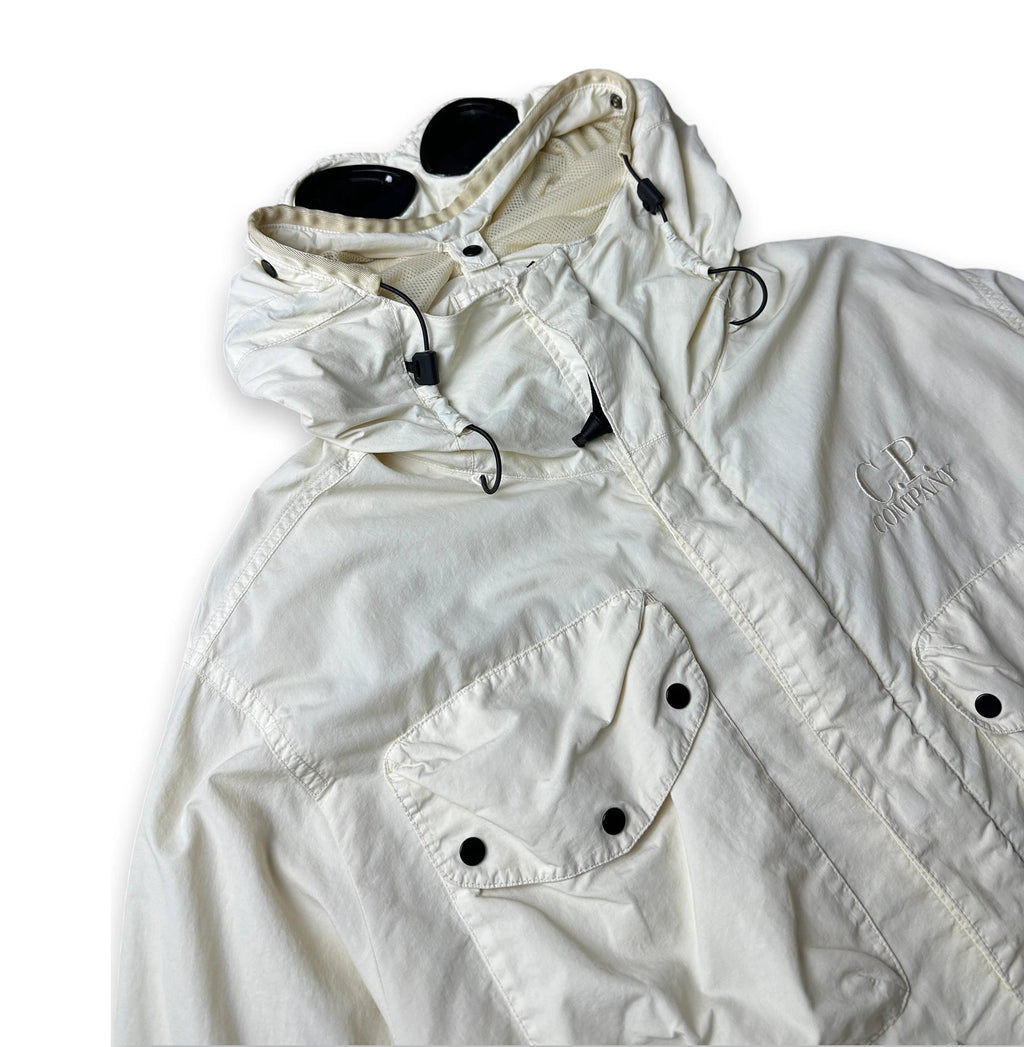 An off-white hooded windbreaker jacket with black snap buttons and drawstrings, featuring a tonal embroidered logo on the chest, displayed on a white background.