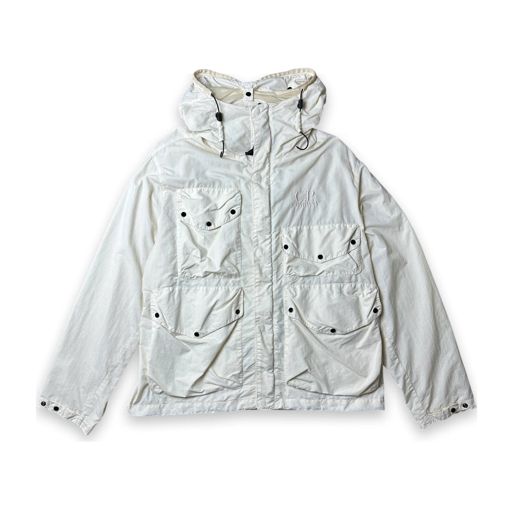A light off-white hooded utility jacket with multiple front pockets and snap-button details, laid flat against a white background.