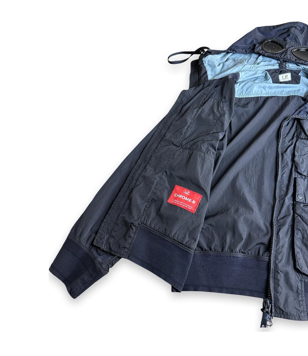 navy cp company jacky folded open with a red label that reads CHROME-R
