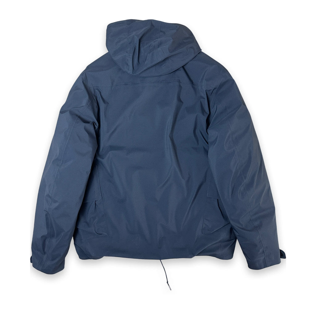 A navy blue hooded jacket shown from the back, laid flat against a solid white background.