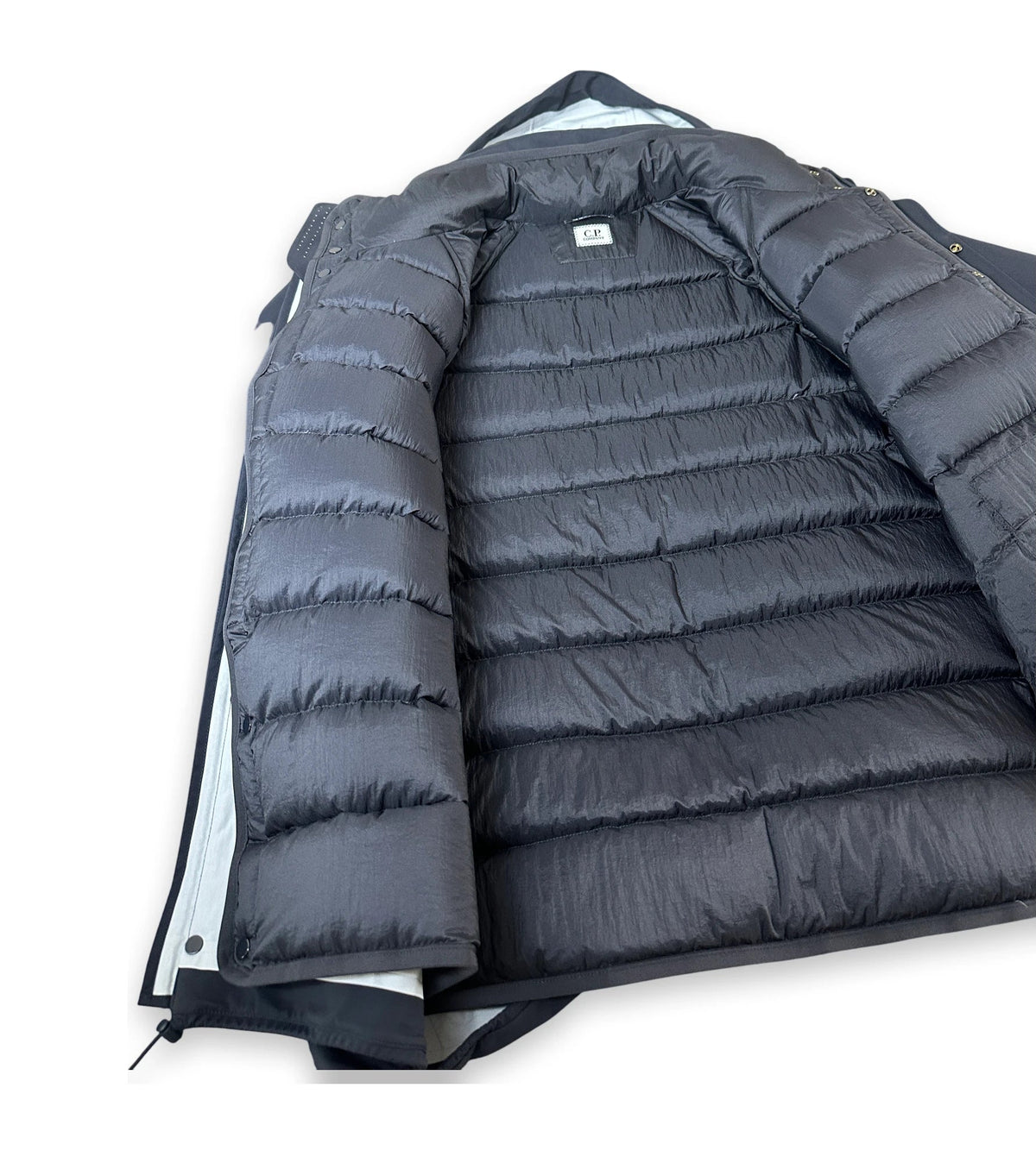 A dark gray puffer jacket with horizontal quilting, shown open against a plain white background.