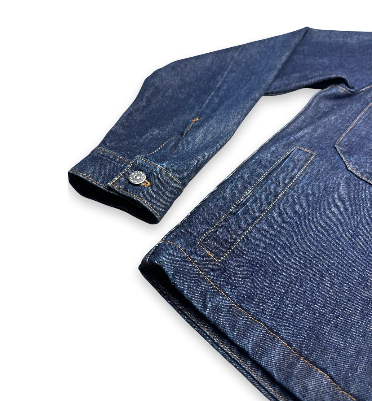Close up on the sleeve of a denim jacket
