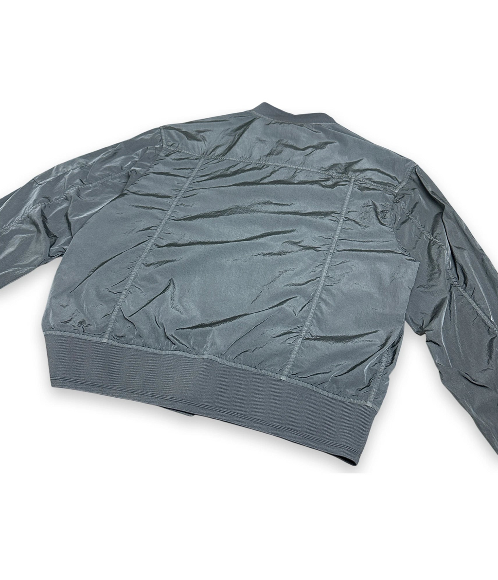 Back of a chrome gray bomber jacket on white background