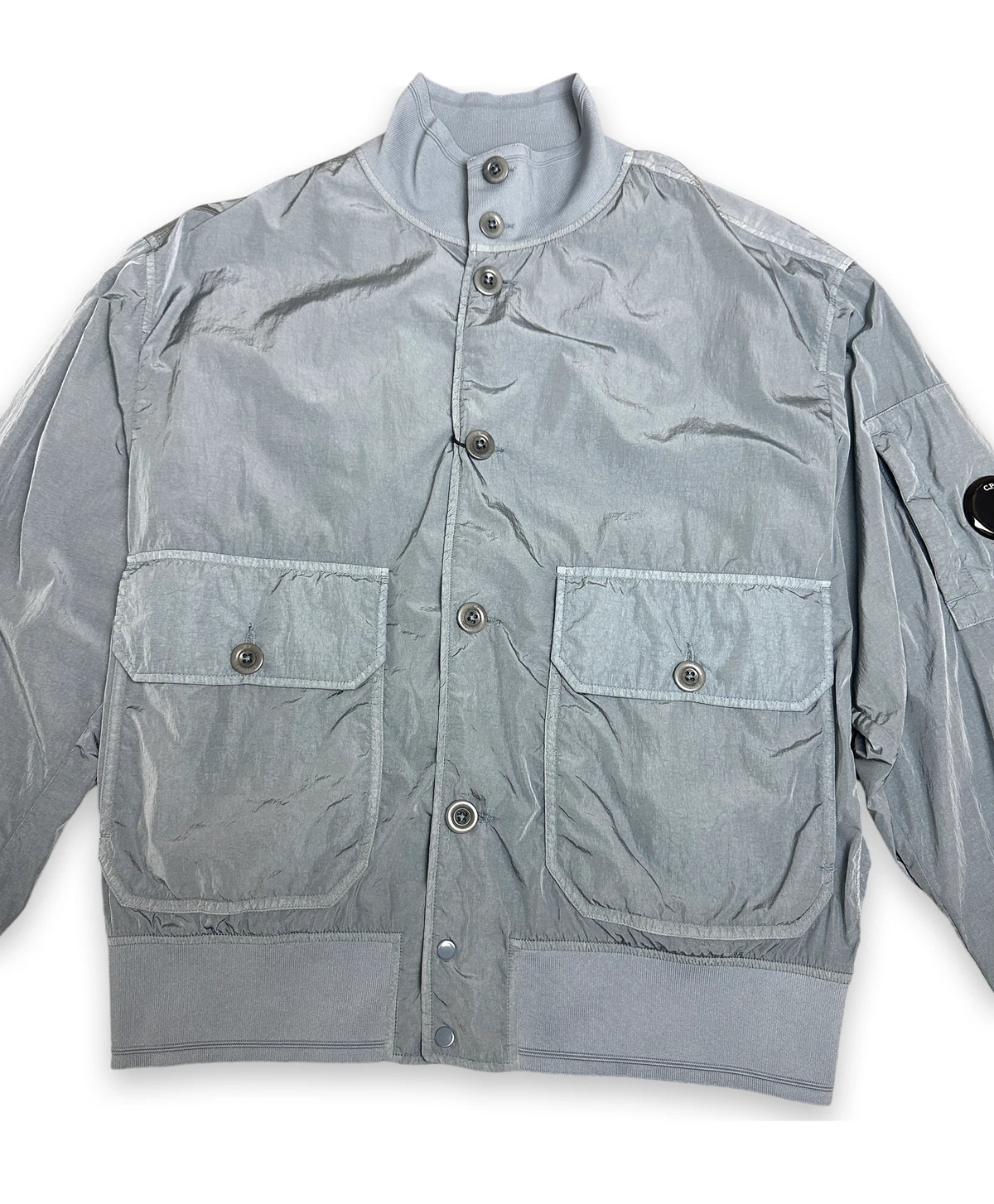 Bomber jacket in chrome color with iconic C.P. Company lens