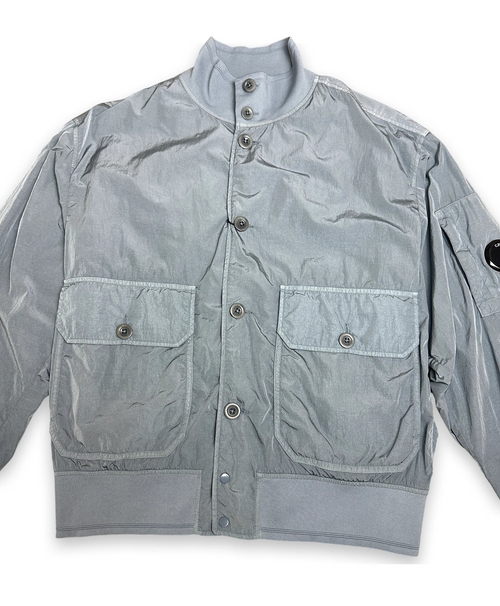 Bomber jacket in chrome color with iconic C.P. Company lens