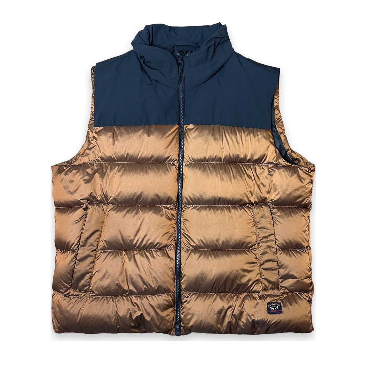 A color-blocked puffer vest with a navy blue upper section and a metallic bronze quilted lower section, featuring a full front zipper and a small brand patch near the bottom right.