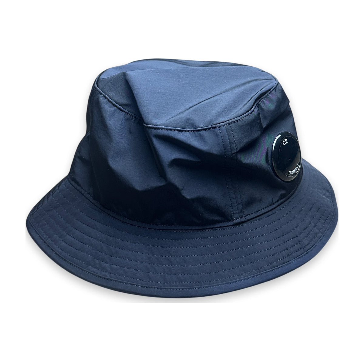 Navy bucket hat with a C.P. Company lens on a white background