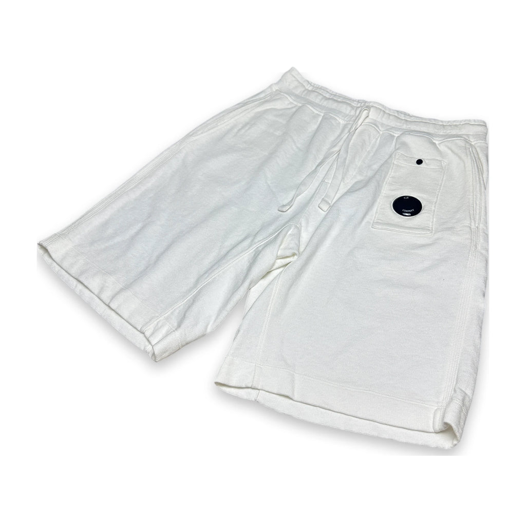 White relaxed sweatpants with a lens of C.P. Company on a white background