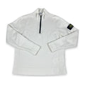 A white long-sleeve quarter-zip pullover sweatshirt with a black zipper and a black Stone Island compass patch on the left sleeve, shown on a plain white background.