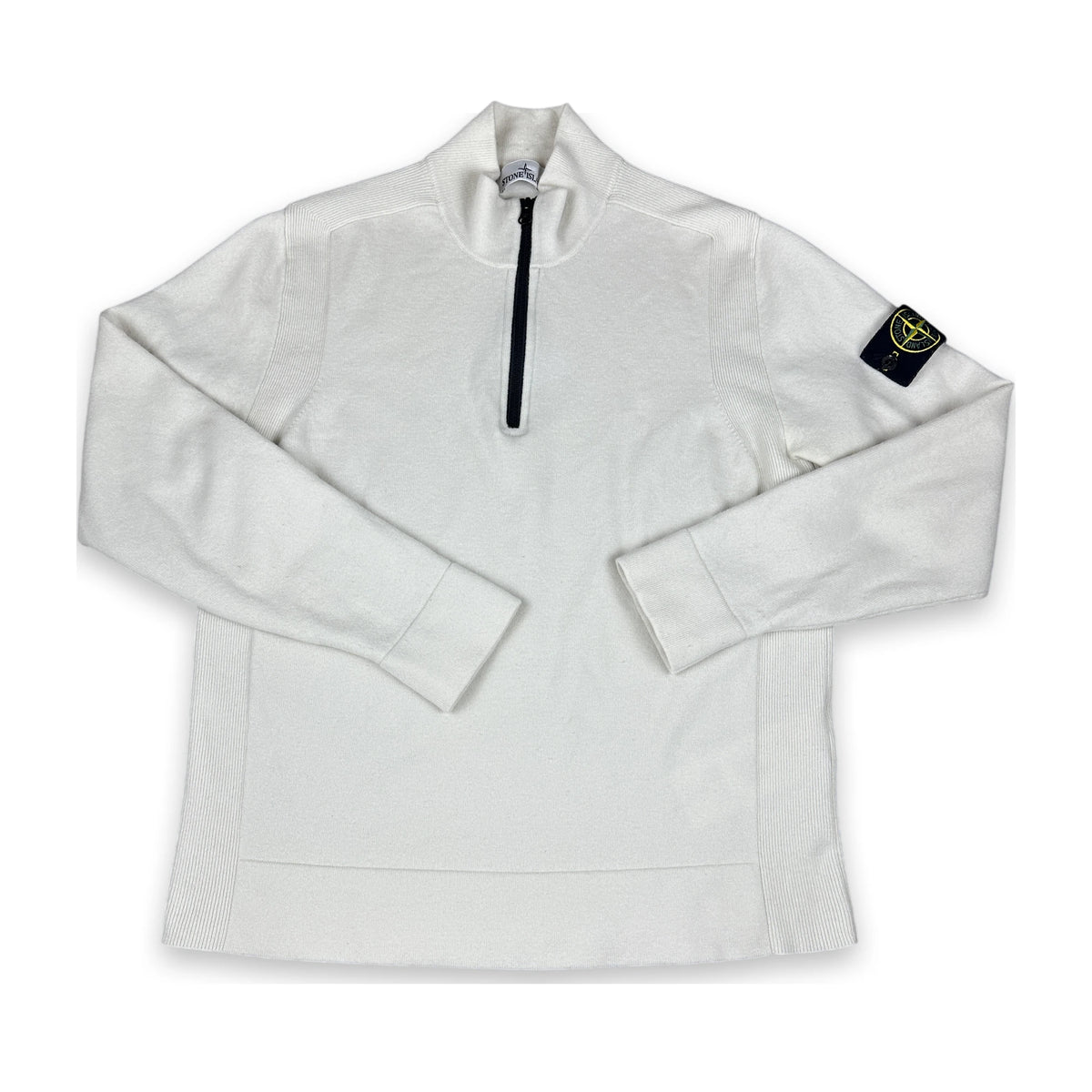 A white long-sleeve quarter-zip pullover sweatshirt with a black zipper and a black Stone Island compass patch on the left sleeve, shown on a plain white background.