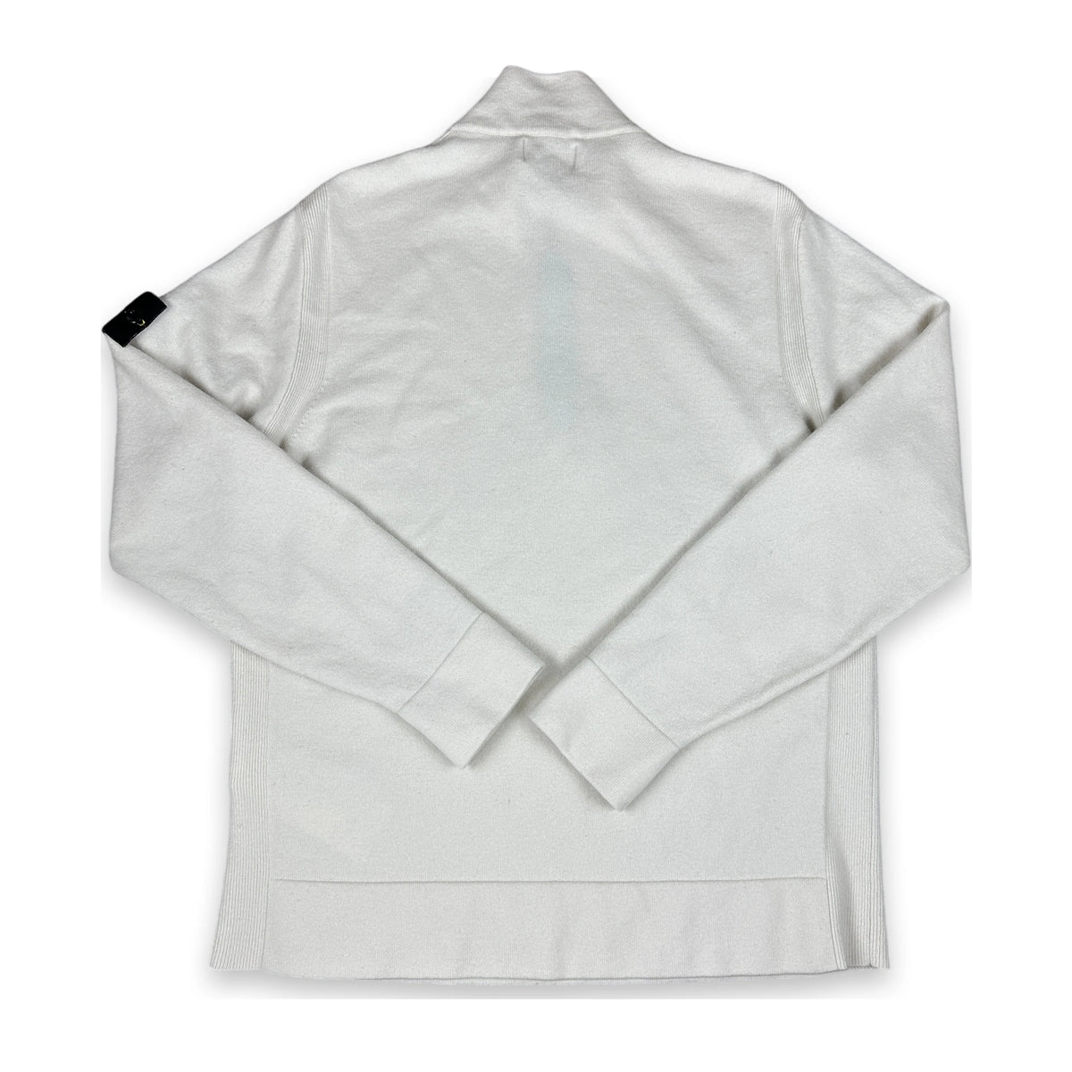 A white long-sleeve quarter-zip jacket with a mock neck collar, shown from the back and laid flat on a white background. A small black fabric tag is visible on the left sleeve.