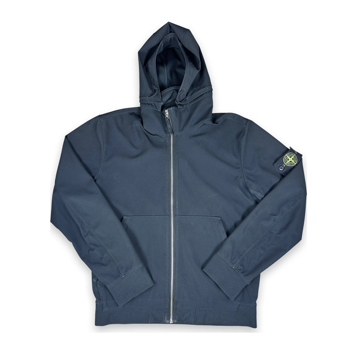 Black soft shell jacket with iconic Stone Island badge on a white background