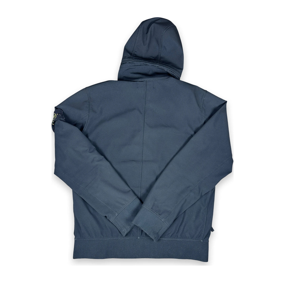 Black soft shell jacket with iconic Stone Island badge on a white background