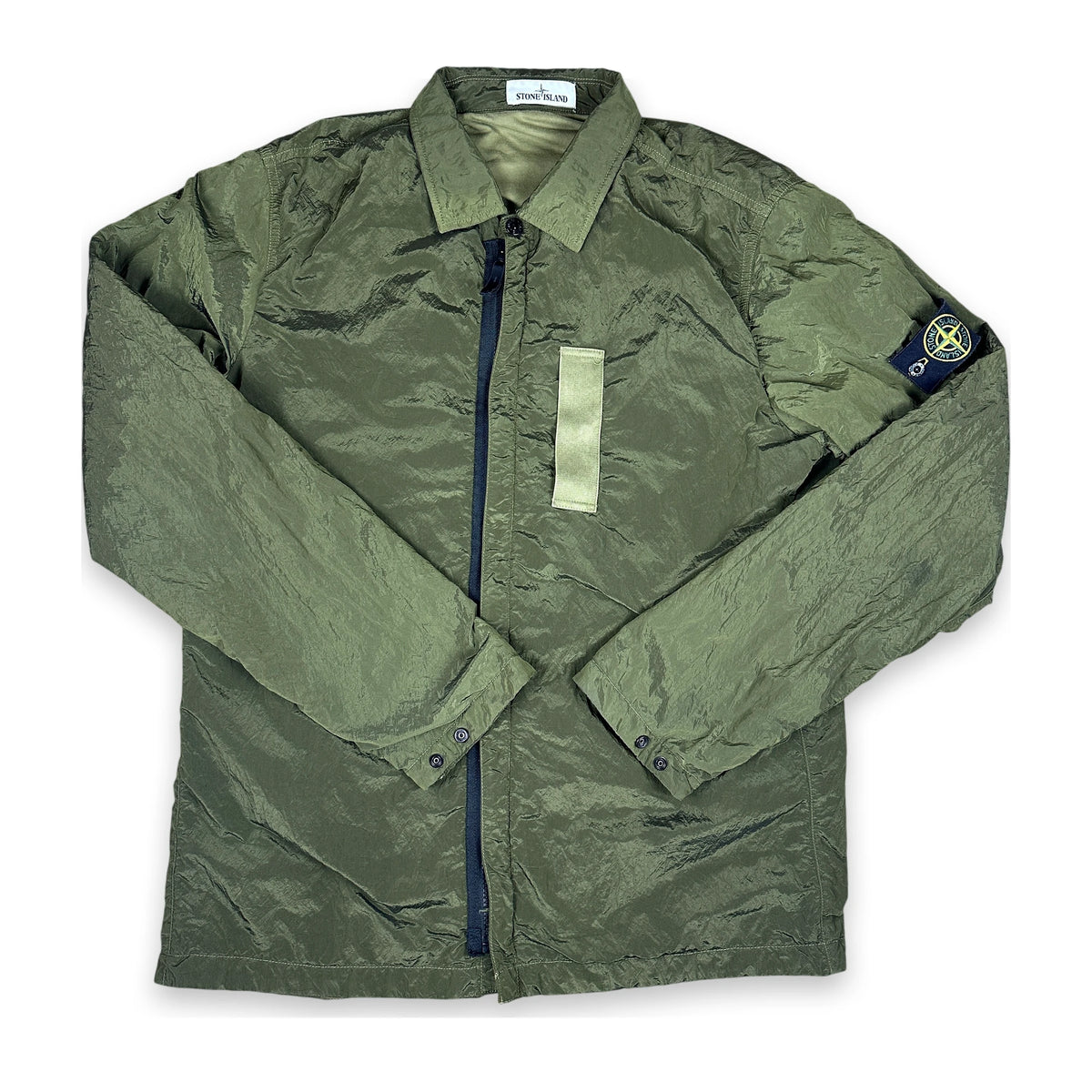 Nylon Metal jacket in green with iconic stone island badge flat layed on a white background